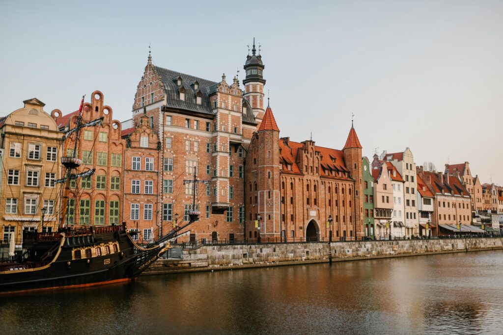 pexels-photo-5273641-5273641 Scenic view of colorful historic buildings along the Motława River in Gdańsk, Poland.